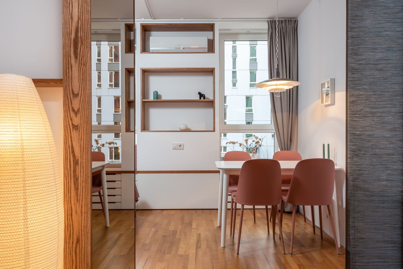 A bright, comfortable UK living room with a wall-mounted air-to-air heat pump